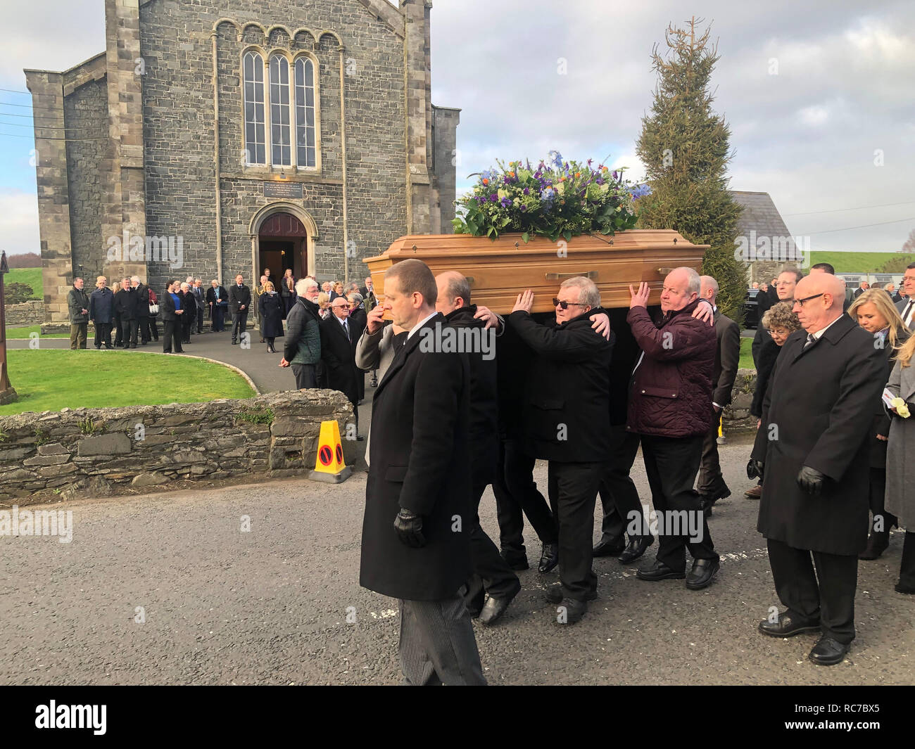 Mourners carry the coffin at the funeral of Ulster historian and politician Dr Ian Adamson at Conlig Presbyterian Church in Co Down. Stock Photo