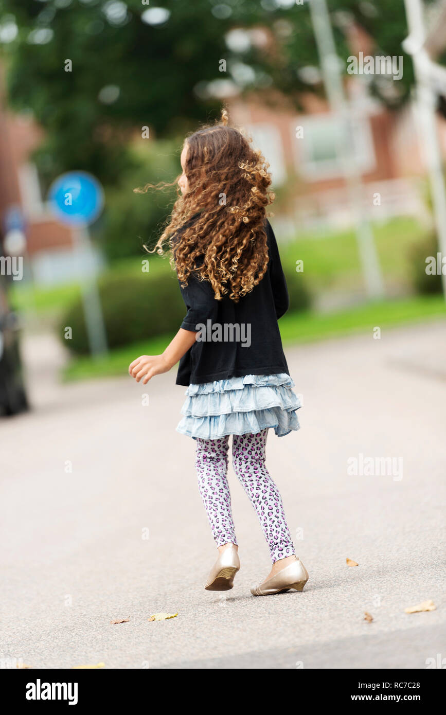 Girl walking outdoors Stock Photo