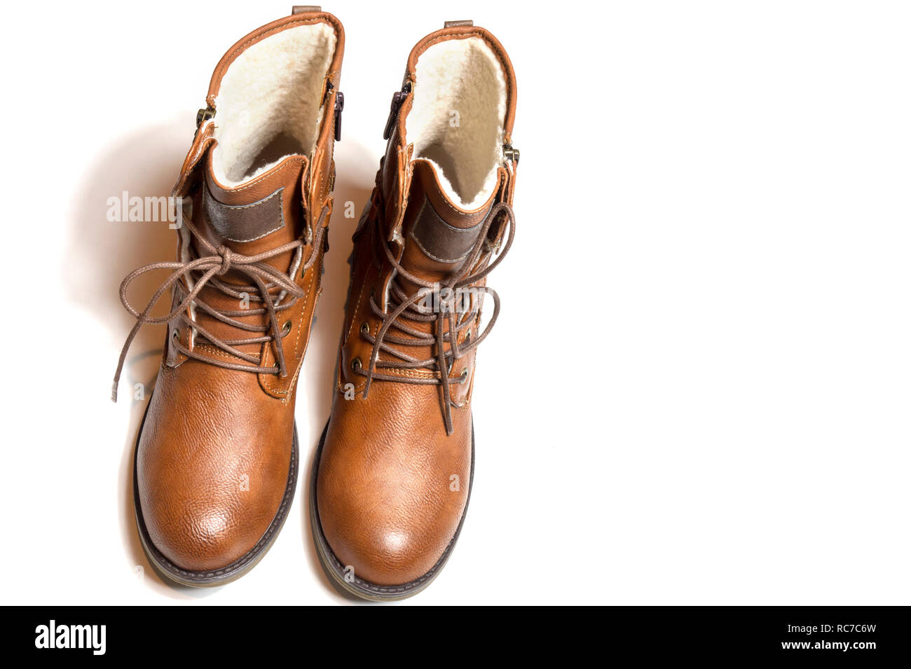 warm brown fashion leather shoes boot for winter on isolated white background Stock Photo