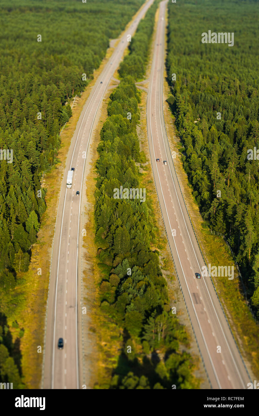 Aerial view of country road through forest Stock Photo