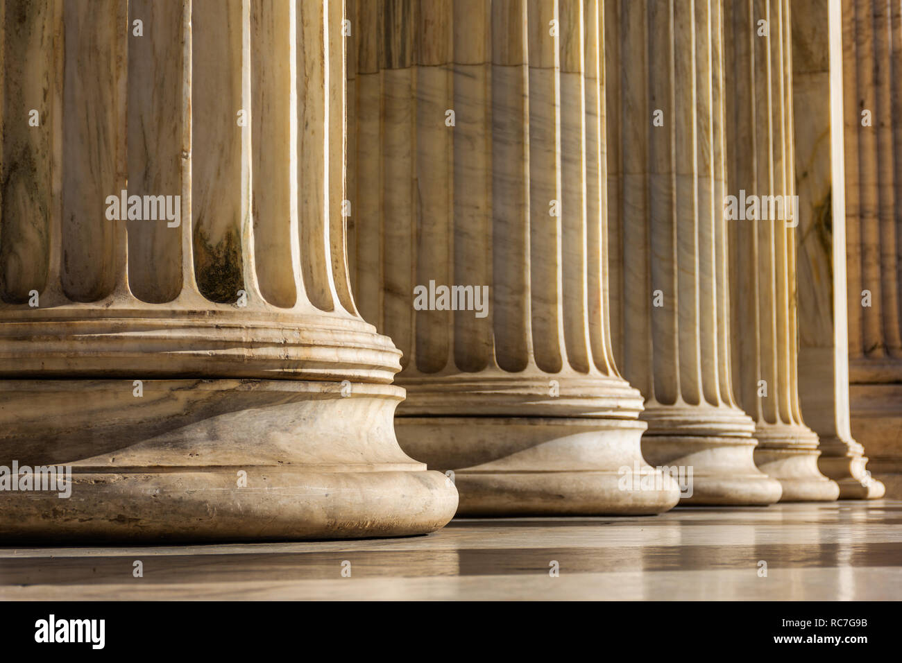 Classical marble pillars detail on the facade of National Academy of Athens, Greece Stock Photo