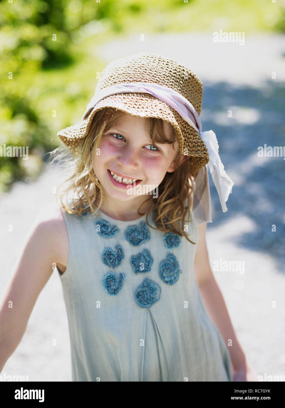 Portrait of girl wearing straw hat Stock Photo Alamy
