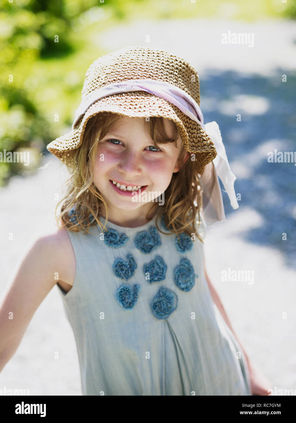 Portrait of girl wearing straw hat Stock Photo Alamy