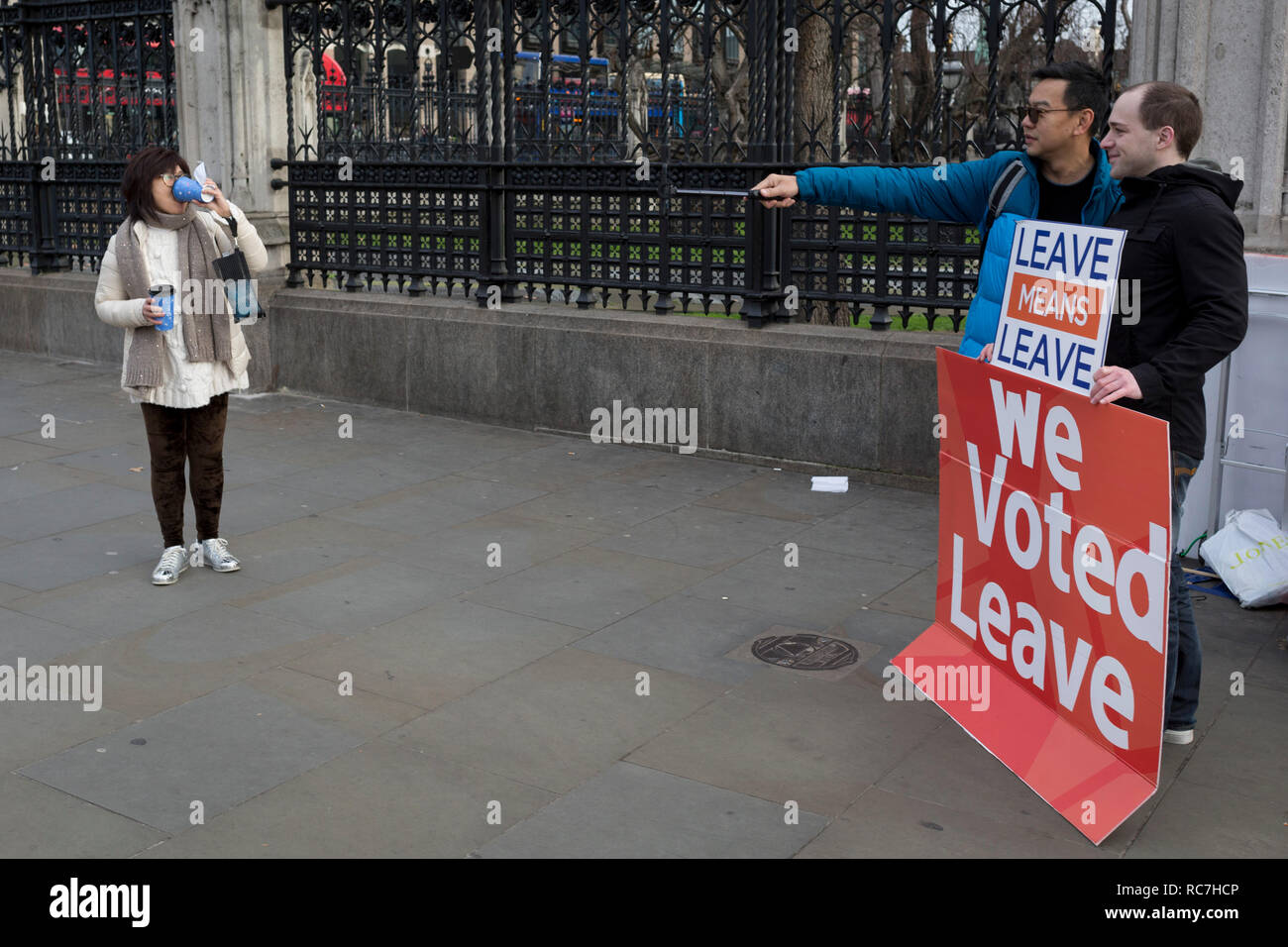 A tourist asks for a selfie with a pro-Brexiter outside the UK Parliament in a week that Prime Minister Theresa May asks for MPs to back her Brexit deal, on 14th January 2019, in Westminster, London, England. Stock Photo