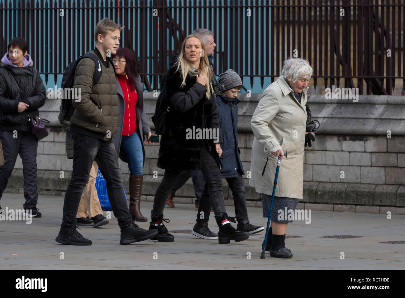 The veteran Liberal Democrat politician, Baroness Williams of Crosby, Shirley Williams, walks unnoticed by others with the aide of a walking stick towards the House of Lords, on 14th January 2019, in Westminster, London, England. Stock Photo