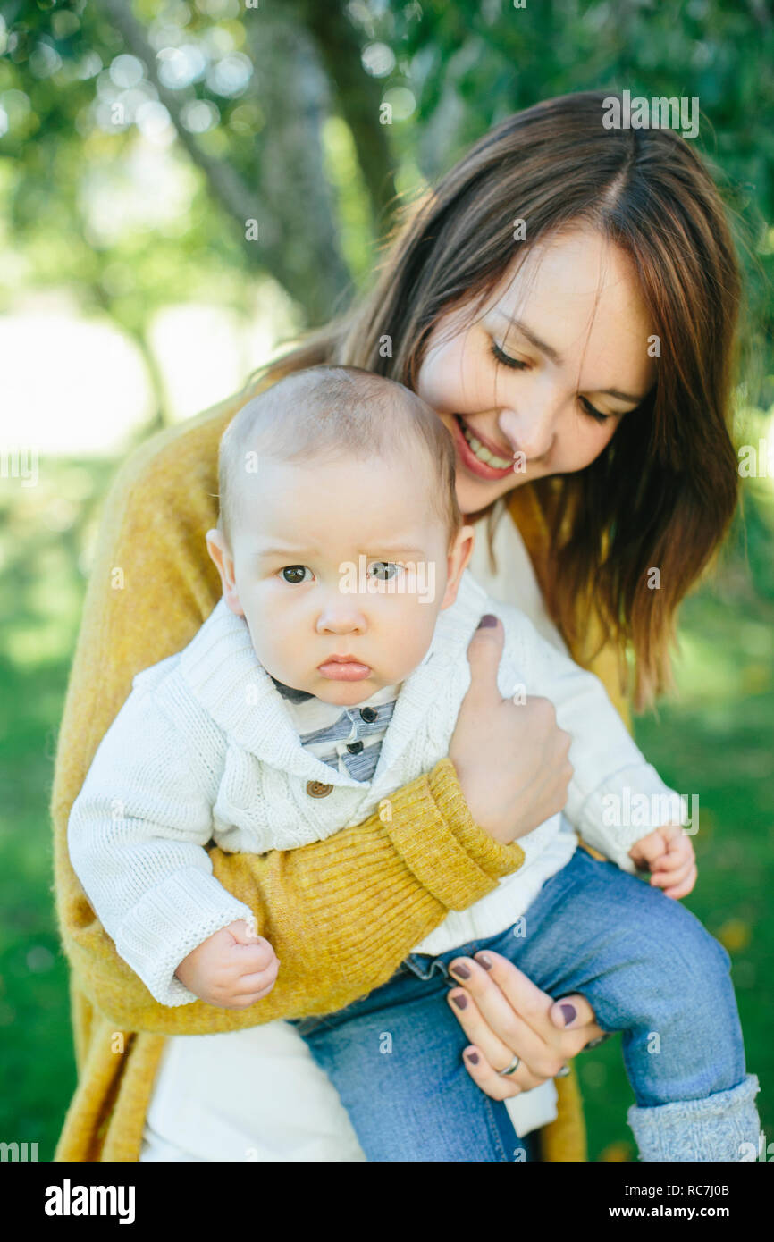Mother holding baby boy Stock Photo Alamy