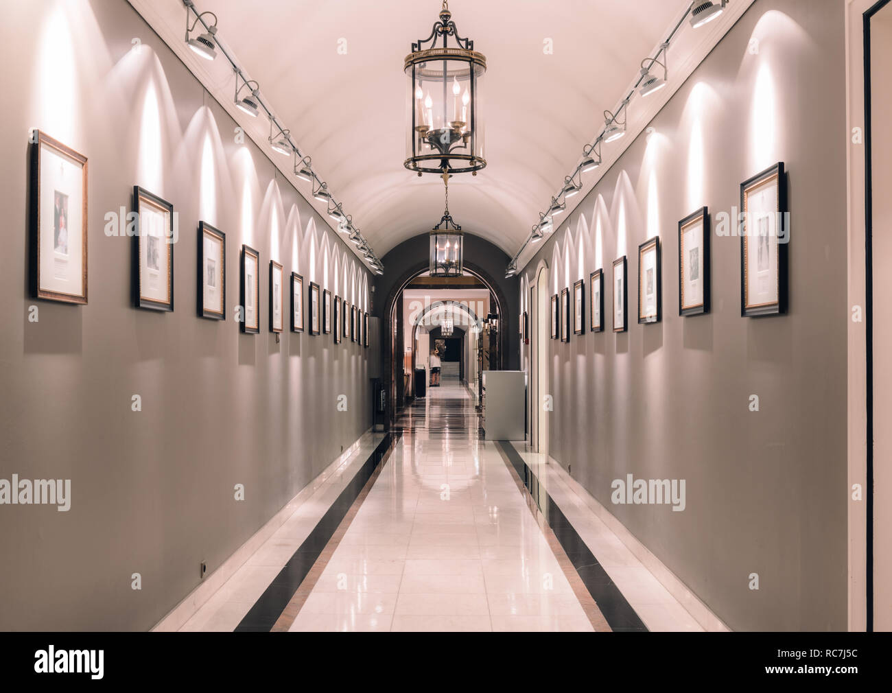 Marble corridor with historic memorabilia at Hotel Palacio in Estoril, Portugal. Shooting location of On Her Majesty's Secret Service James Bond Stock Photo