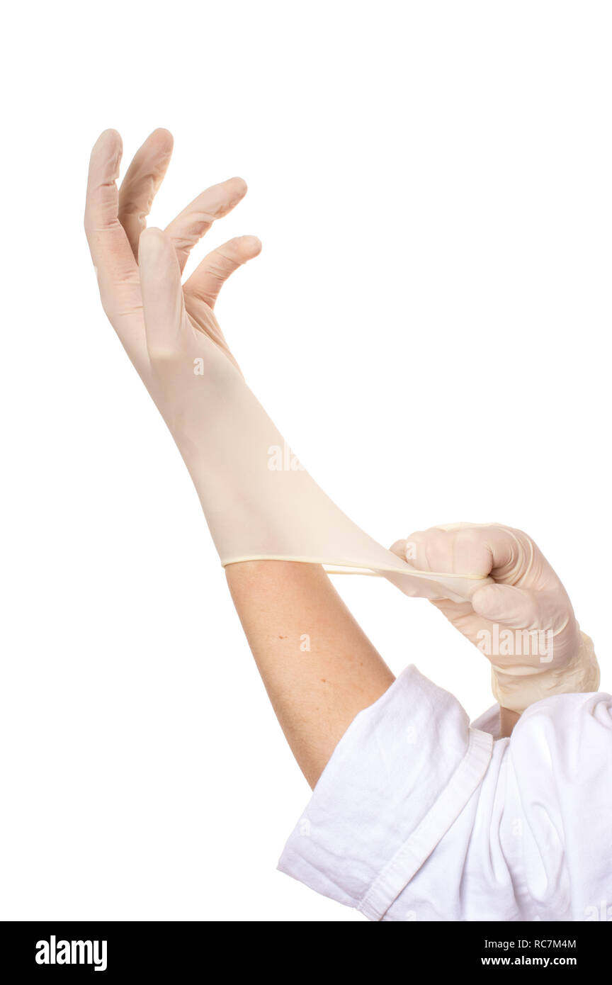 two hands putting on rubber gloves Stock Photo