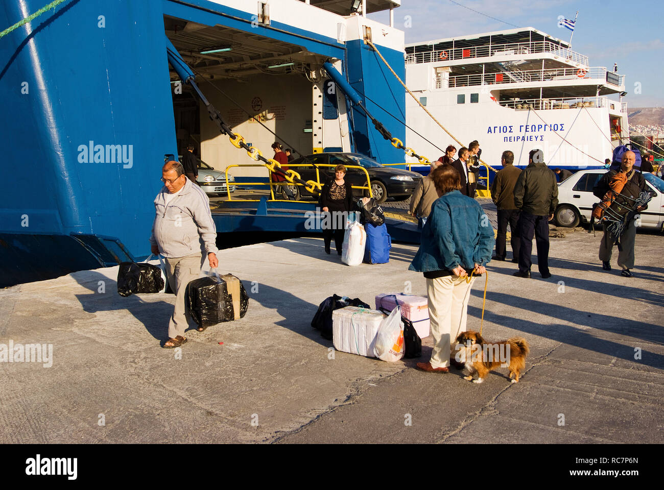 passengers disembarking from a ferry in port of Piraeus, Greece Stock Photo