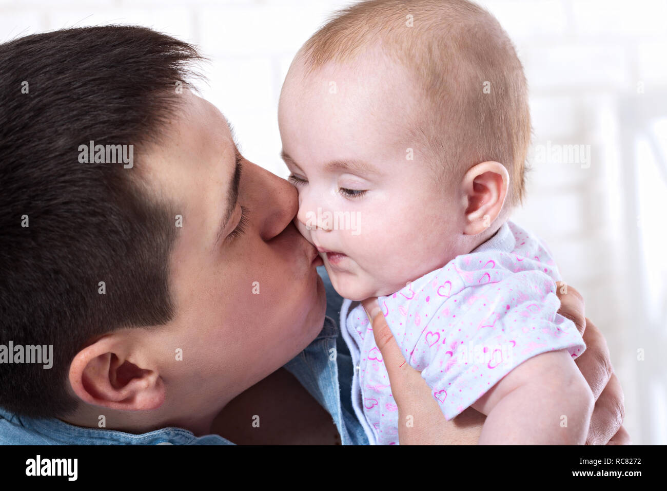 baby with dad. family, parenthood and people concept - father with little baby at home Stock Photo