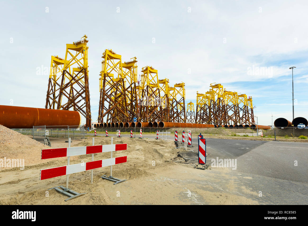 Foundations for offshore wind turbines stored Vlissingen harbour; these platforms are called jacket. waiting to be shipped to new north sea Borssele wind farm, Netherlands Stock Photo