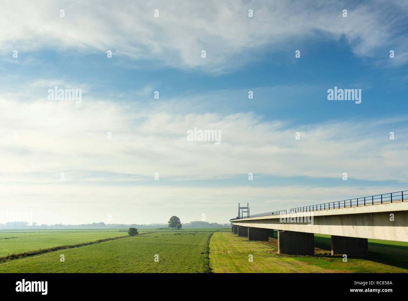 Bridge crossing  floodland and river Waal (dutch part of the Rhine) in autumn, Netherlands Stock Photo