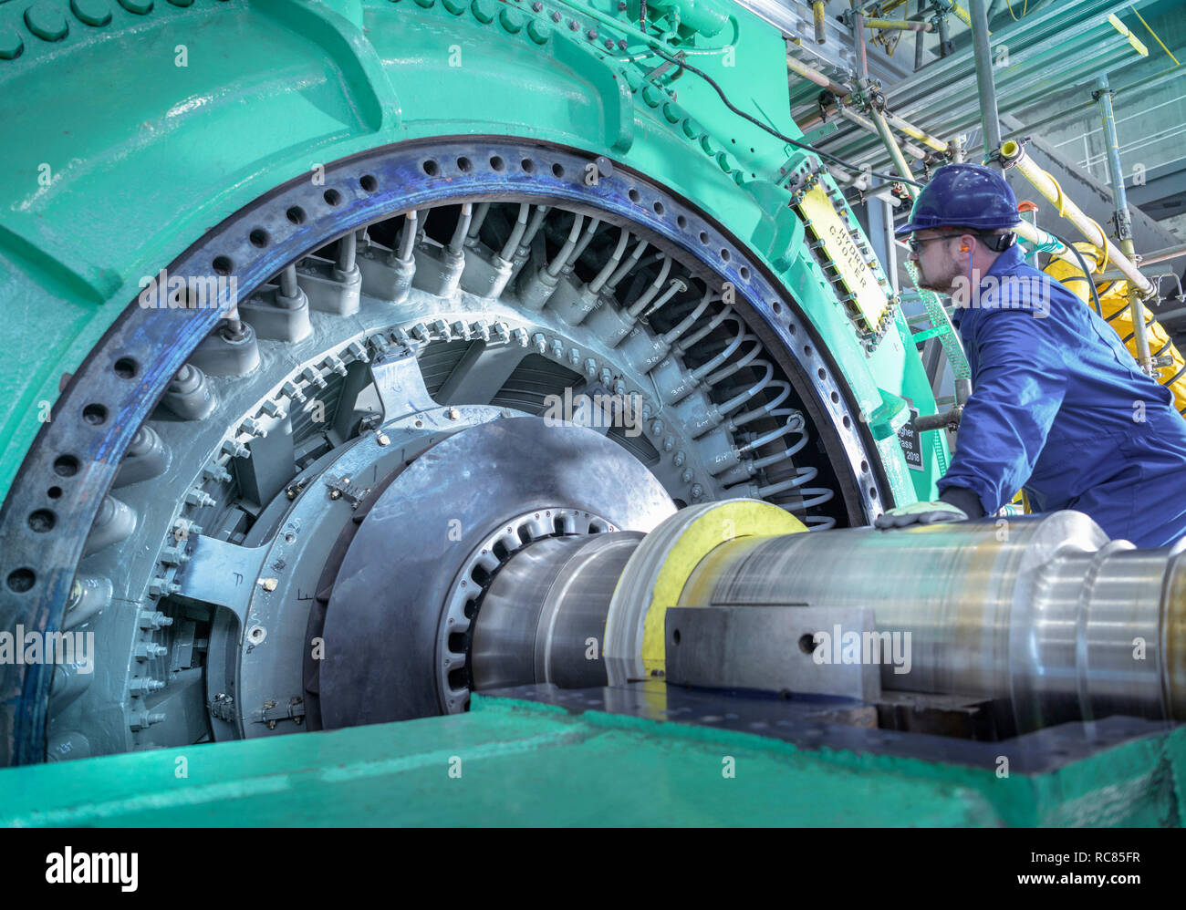 Engineer inspecting generator in nuclear power station during outage Stock Photo