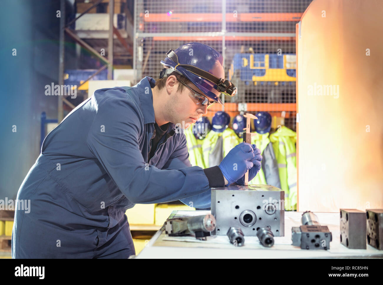 Engineer inspecting valves during outage in nuclear power station Stock Photo