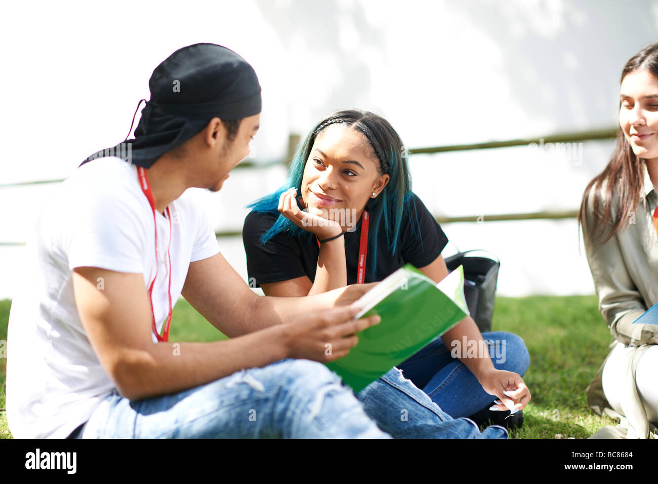 College students reading and talking in campus Stock Photo