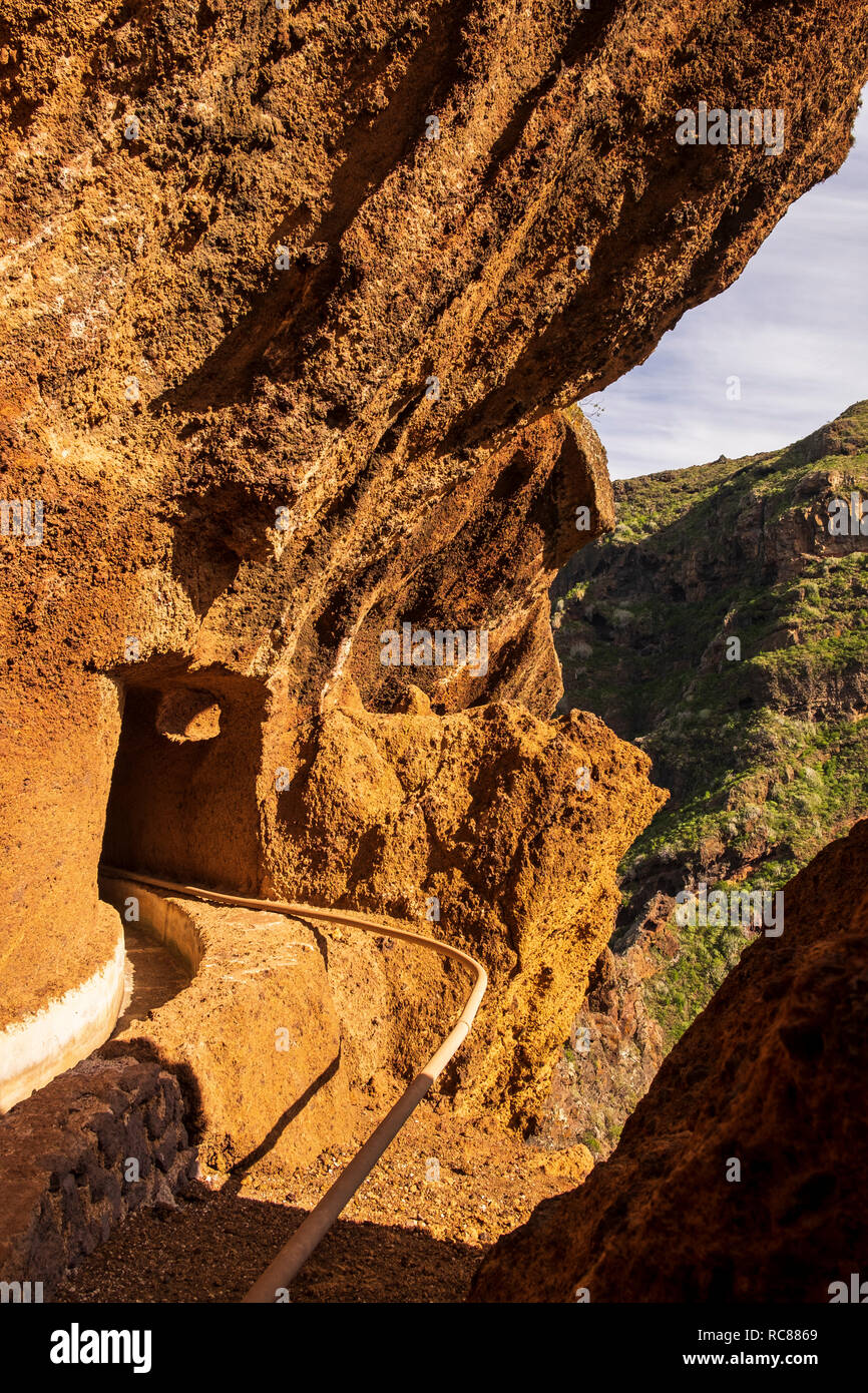 Walking in the water canal on the side of the Barranco Seco in the Anaga region of Tenerife, Canary Islands, Spain Stock Photo
