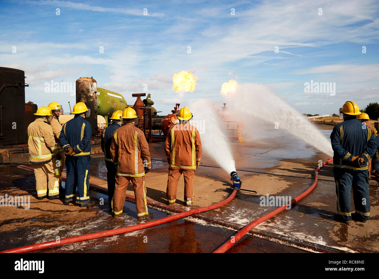 Firemen training to put out fire on burning tanks, Darlington, UK Stock Photo