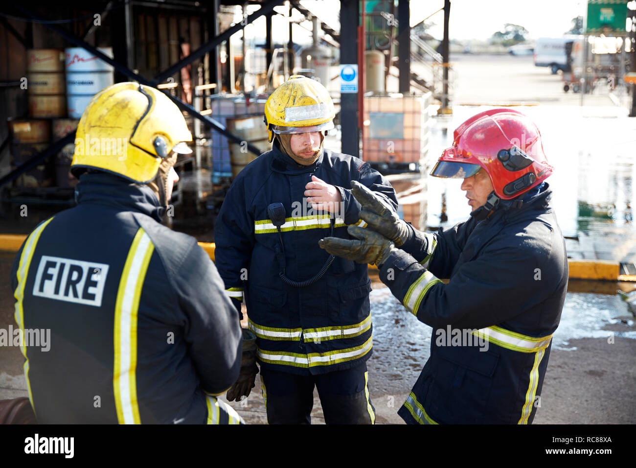Firemen in discussion in training centre, Darlington, UK Stock Photo