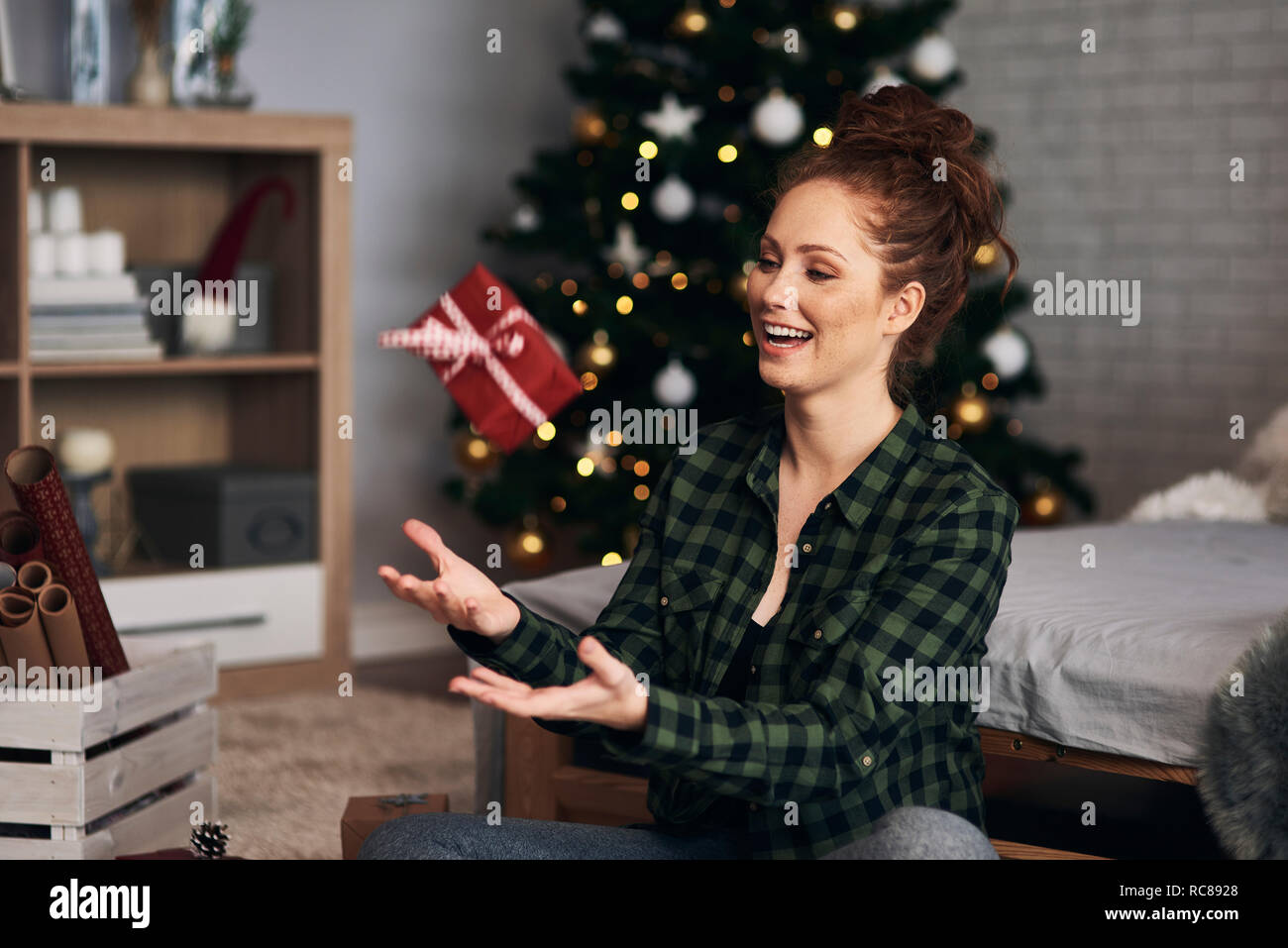 Woman wrapping Christmas presents Stock Photo