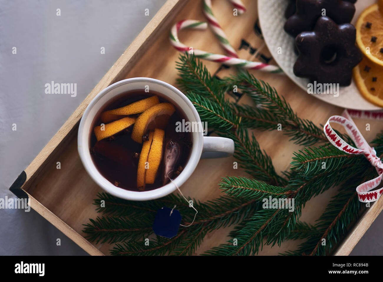 Festive tray of warm drink, Christmas biscuits and Yew tree branch Stock Photo