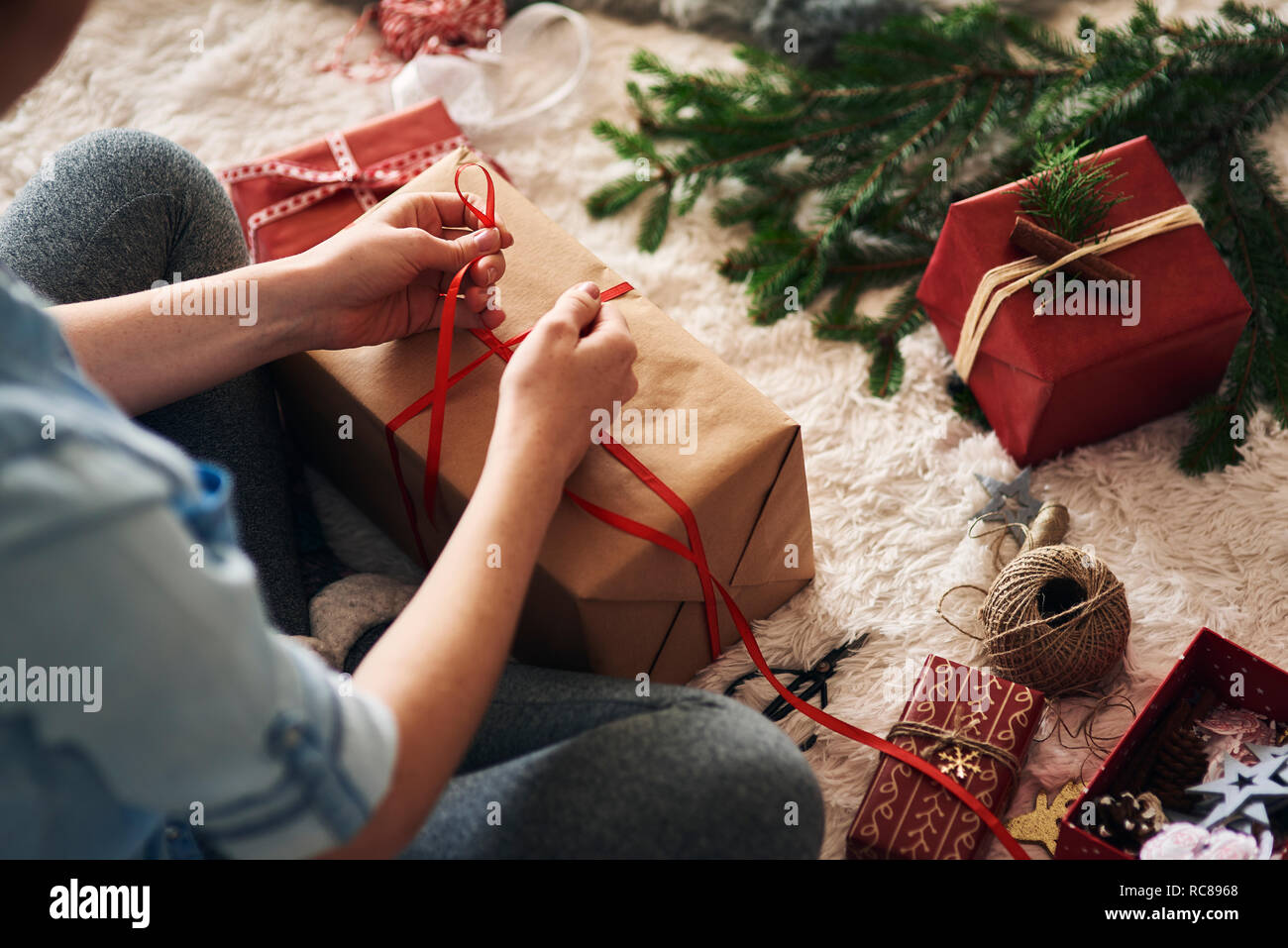 Woman wrapping Christmas presents Stock Photo