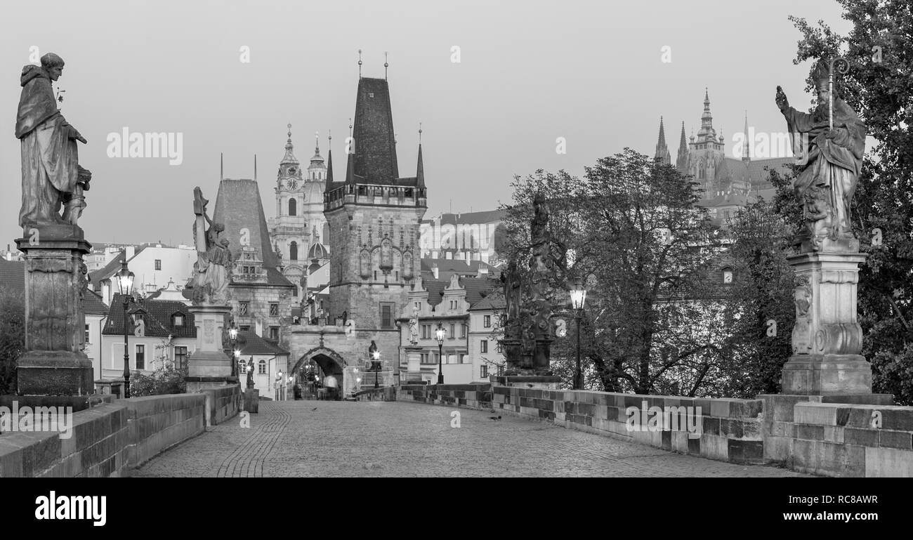 Prague - The Castle and Cathedral and st. Nicholas church from Charles Bridge in the morning dusk. Stock Photo