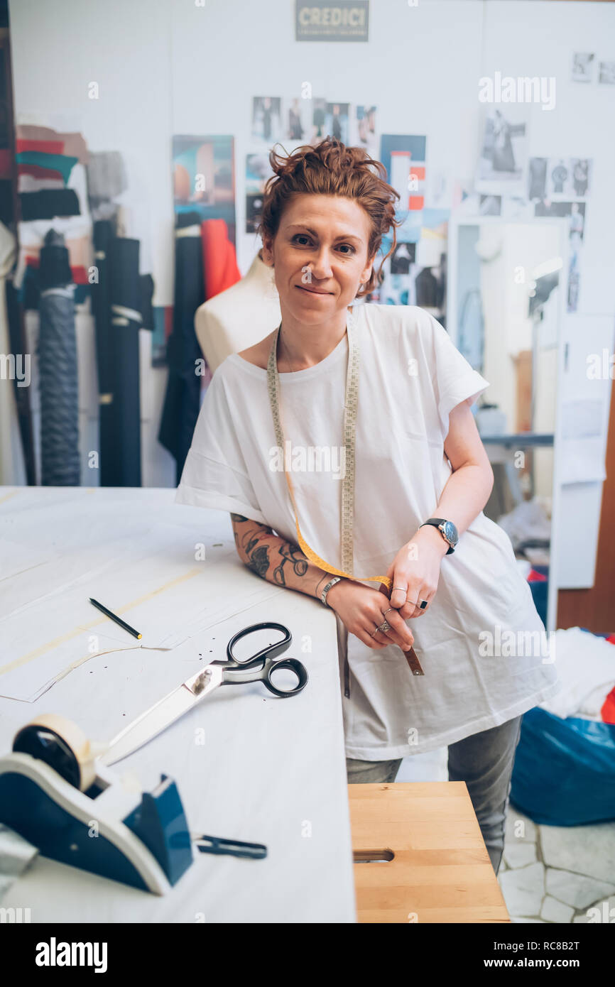 Portrait of fashion designer in her work studio Stock Photo