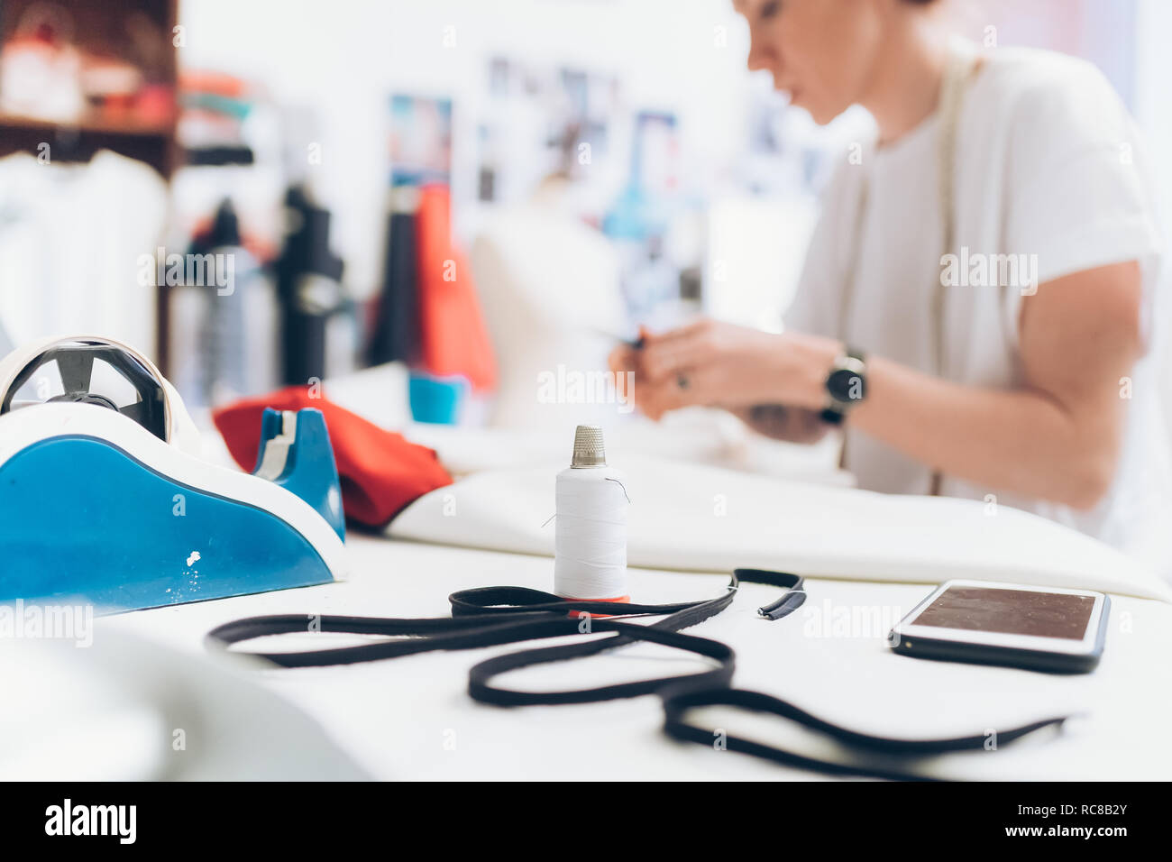 Fashion designer working in her studio Stock Photo