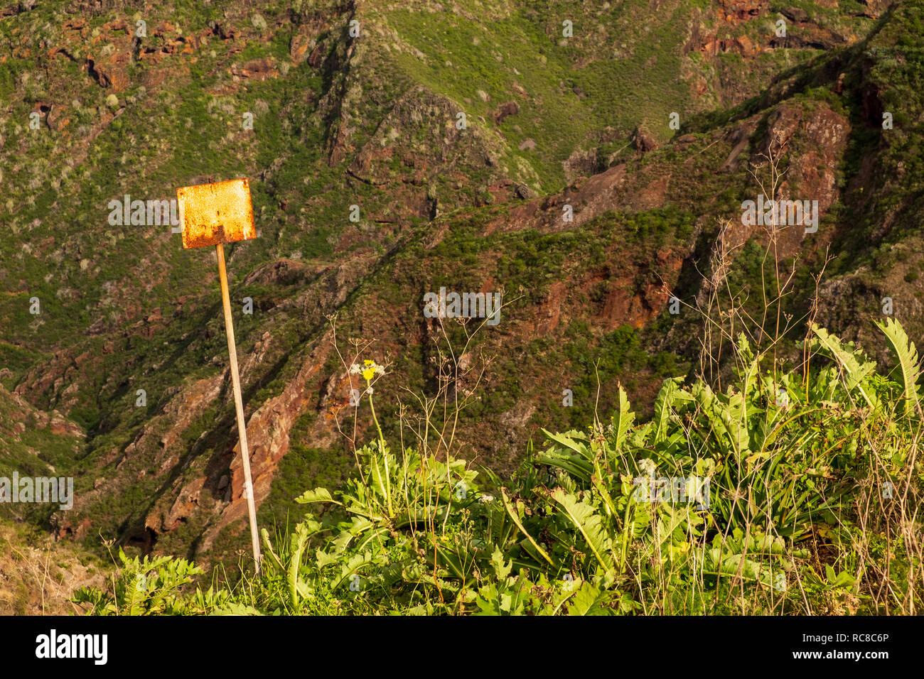 Blank rusted sign on the side of the Barranco del Tomadero  in the Anaga region of Tenerife, Canary Islands, Spain Stock Photo