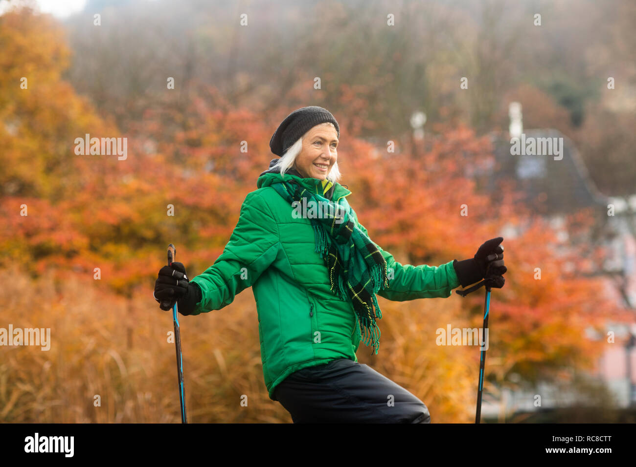 Mature woman wearing hat walking hi-res stock photography and images ...