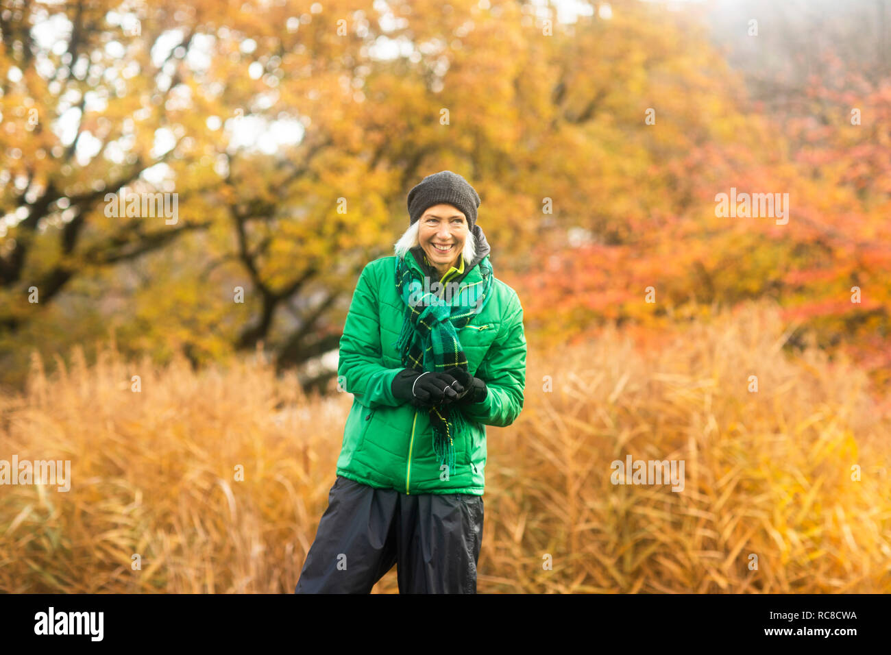 Mature woman exercising in park Stock Photo