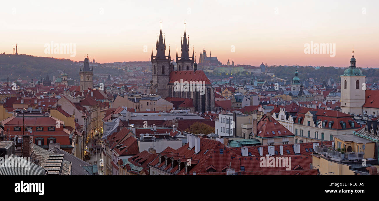 Prague - The dusk panorama of the City with the Church of Our Lady before Týn and Castle with the Cathedral in the background at dusk. Stock Photo