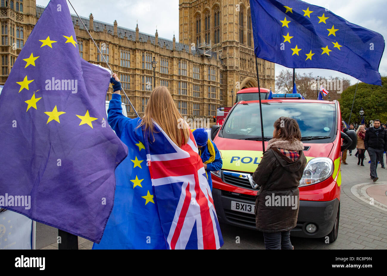 Pro Europe supporters waving EU flags outside Parliament, Westminster. Demonstrators in favour of Staying in Europe and the 28 member states. Stock Photo