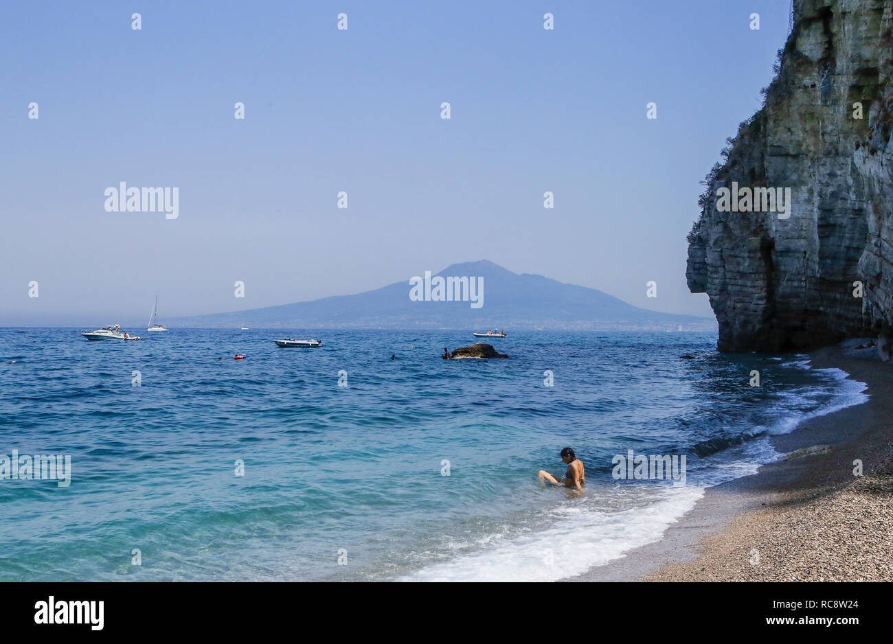 The beach on Amalfi Coast, the volcano Mount Vesuvius in the background