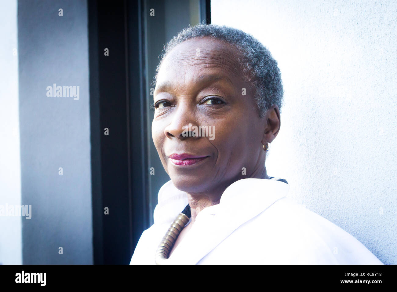 Close up of black mature woman outside Stock Photo - Alamy