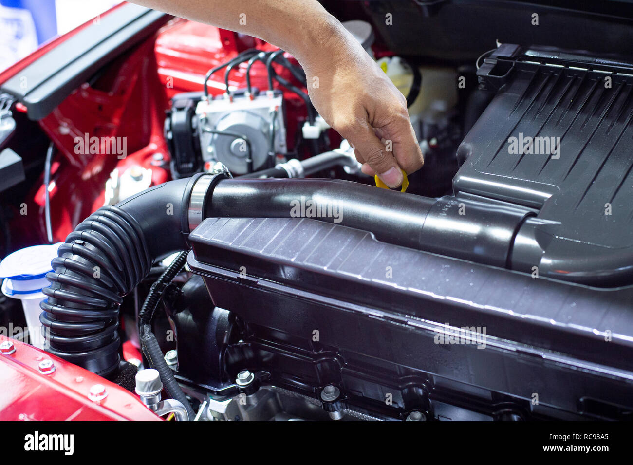 Check the engine oil level in the car by yourself. Service and maintenance of cars or vehicles - images Stock Photo