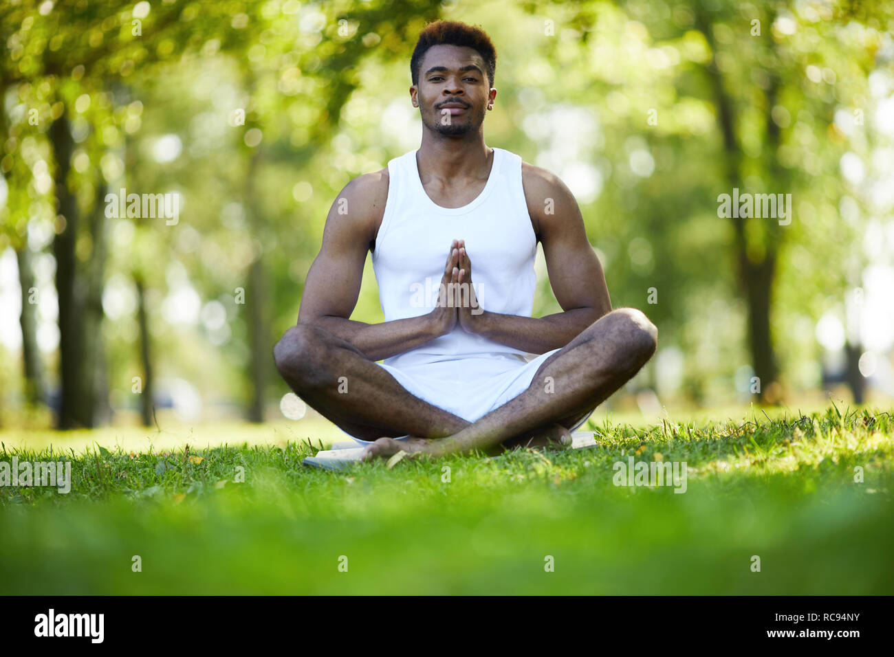 Young black man practicing yoga Stock Photo