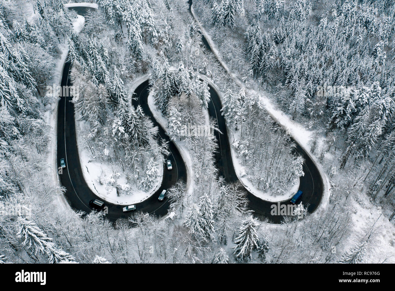 Driving in winter conditions on a highway trough the mountains Stock ...