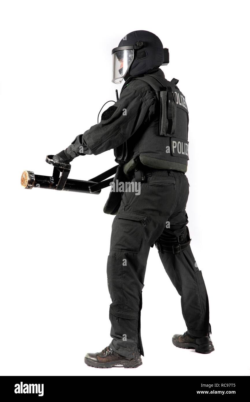 Police, Special Task Force, SEK, officer holding a metal battering ram for the forced entry of doors and windows Stock Photo