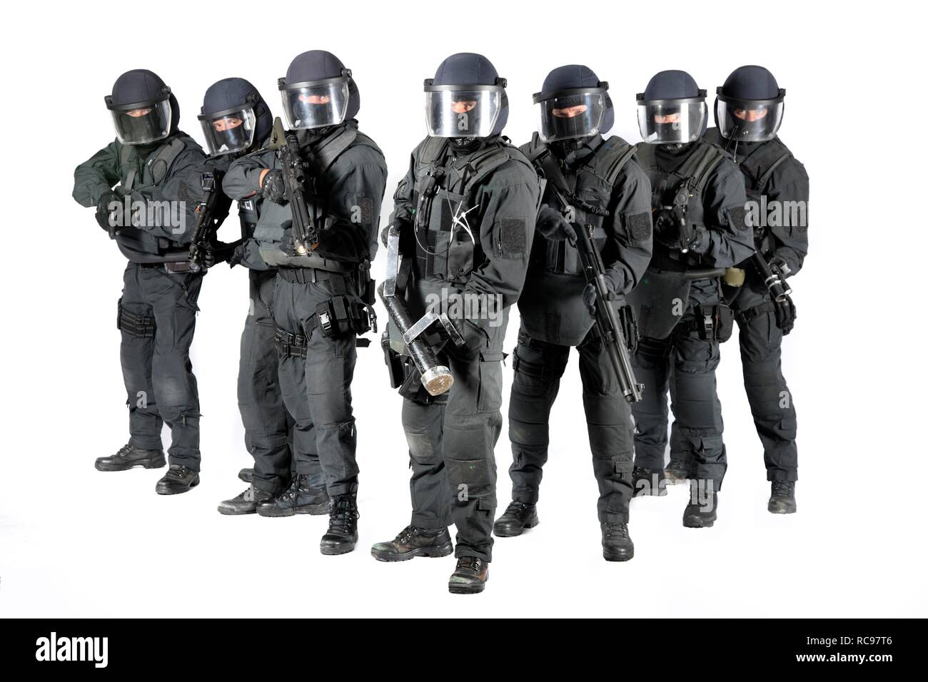 Police, Special Task Force, SEK, squad holding a metal battering ram and various weapons Stock Photo