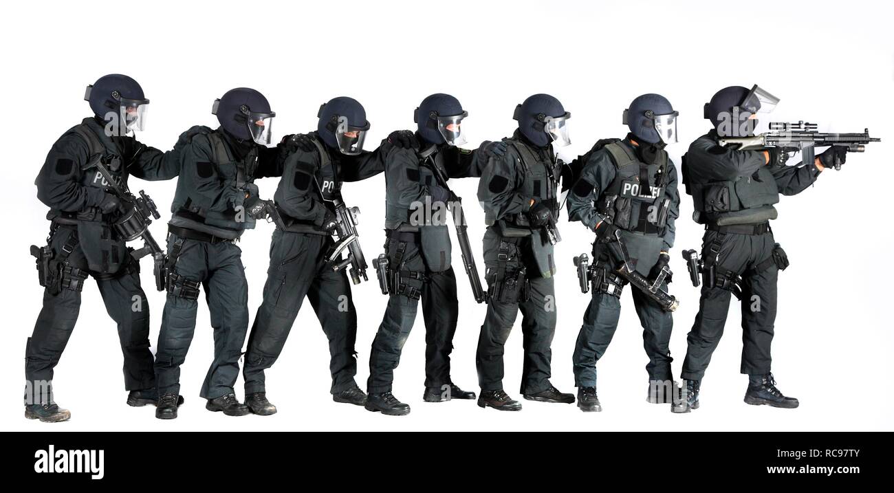 Police, Special Task Force, SEK, squad holding a metal battering ram and various weapons Stock Photo