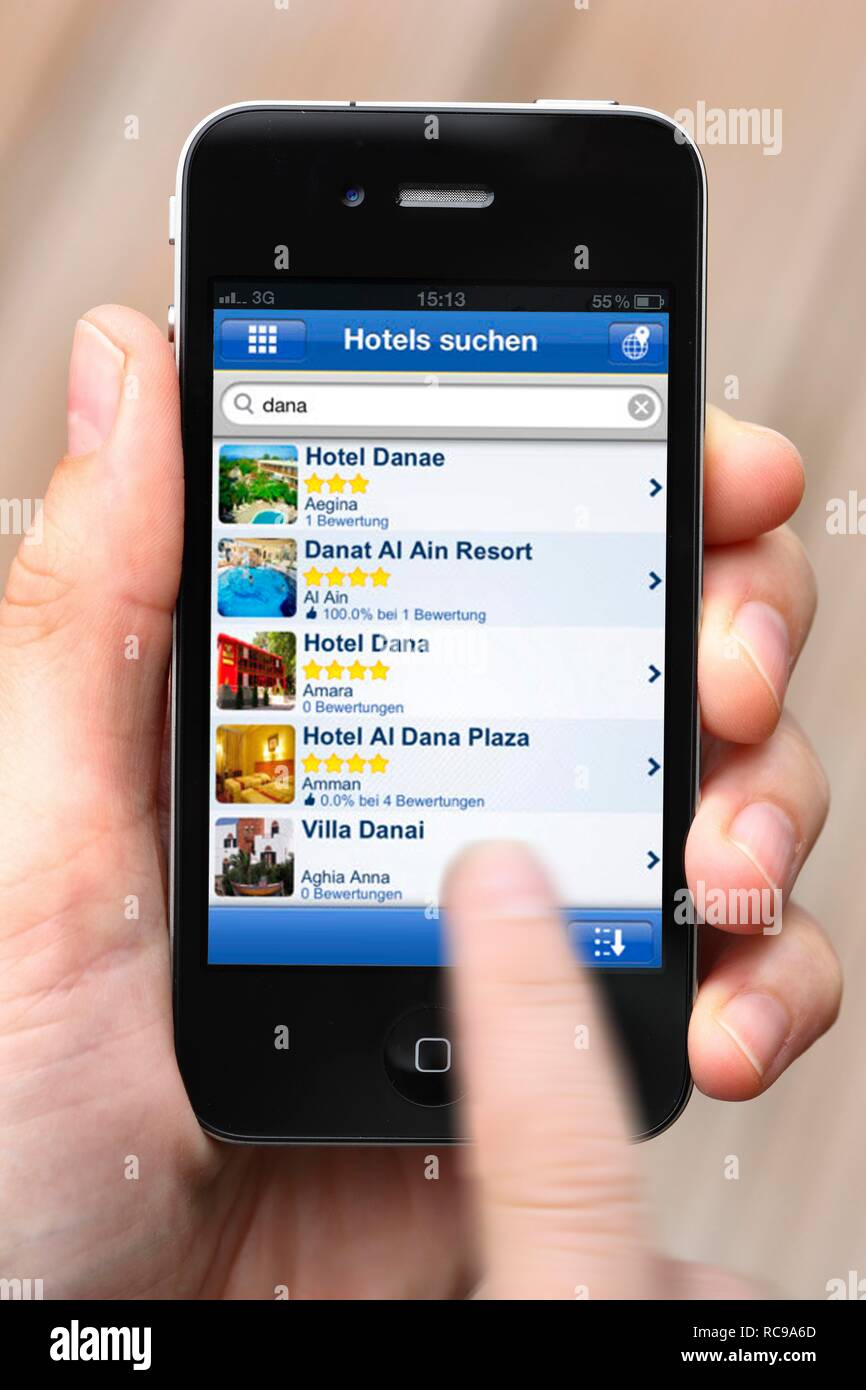 Iphone, smart phone, app on the screen, hotel reservation service, hotel reviews Stock Photo
