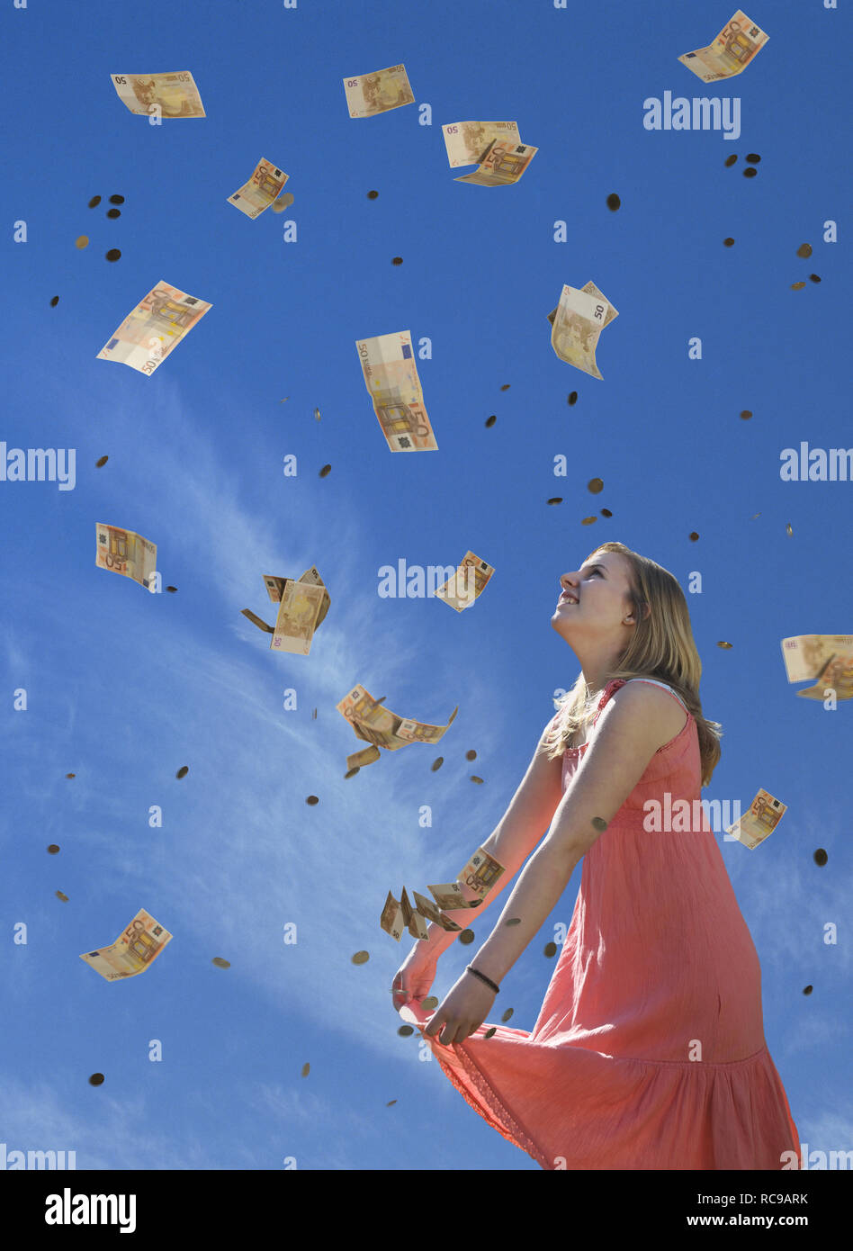 jugendliches Mädchen empfängt Geldregen | young female teenager receiving money rain Stock Photo