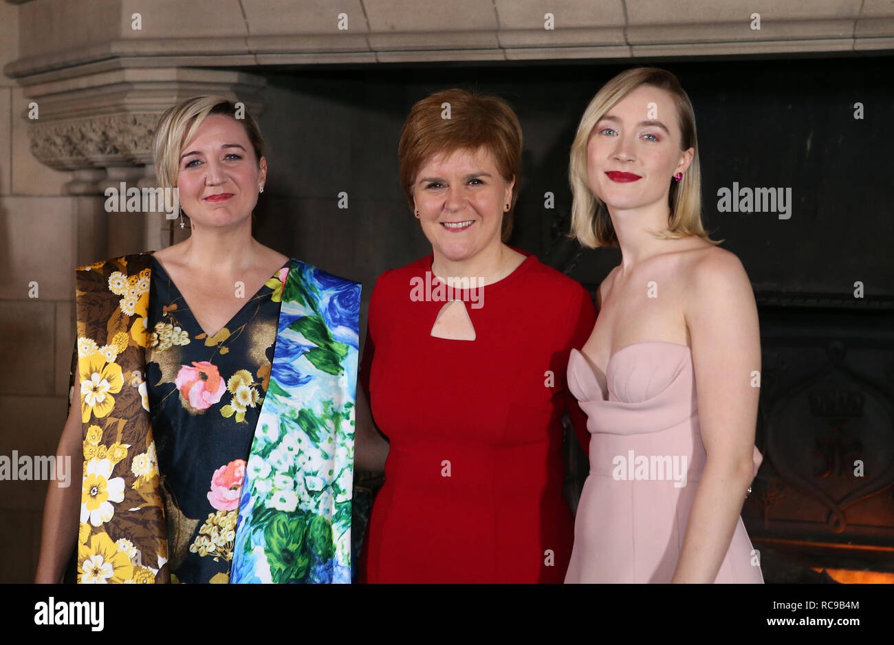 (left to right) Director Josie Rourke, First Minister Nicola Sturgeon and actress Saoirse Ronan arriving at the Scottish premiere of Mary Queen of Scots at Edinburgh Castle. Stock Photo