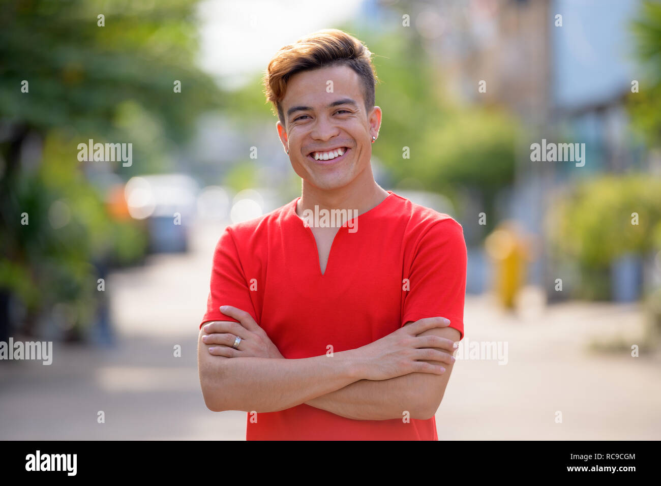 Happy persian man smiling arms hi-res stock photography and images - Alamy