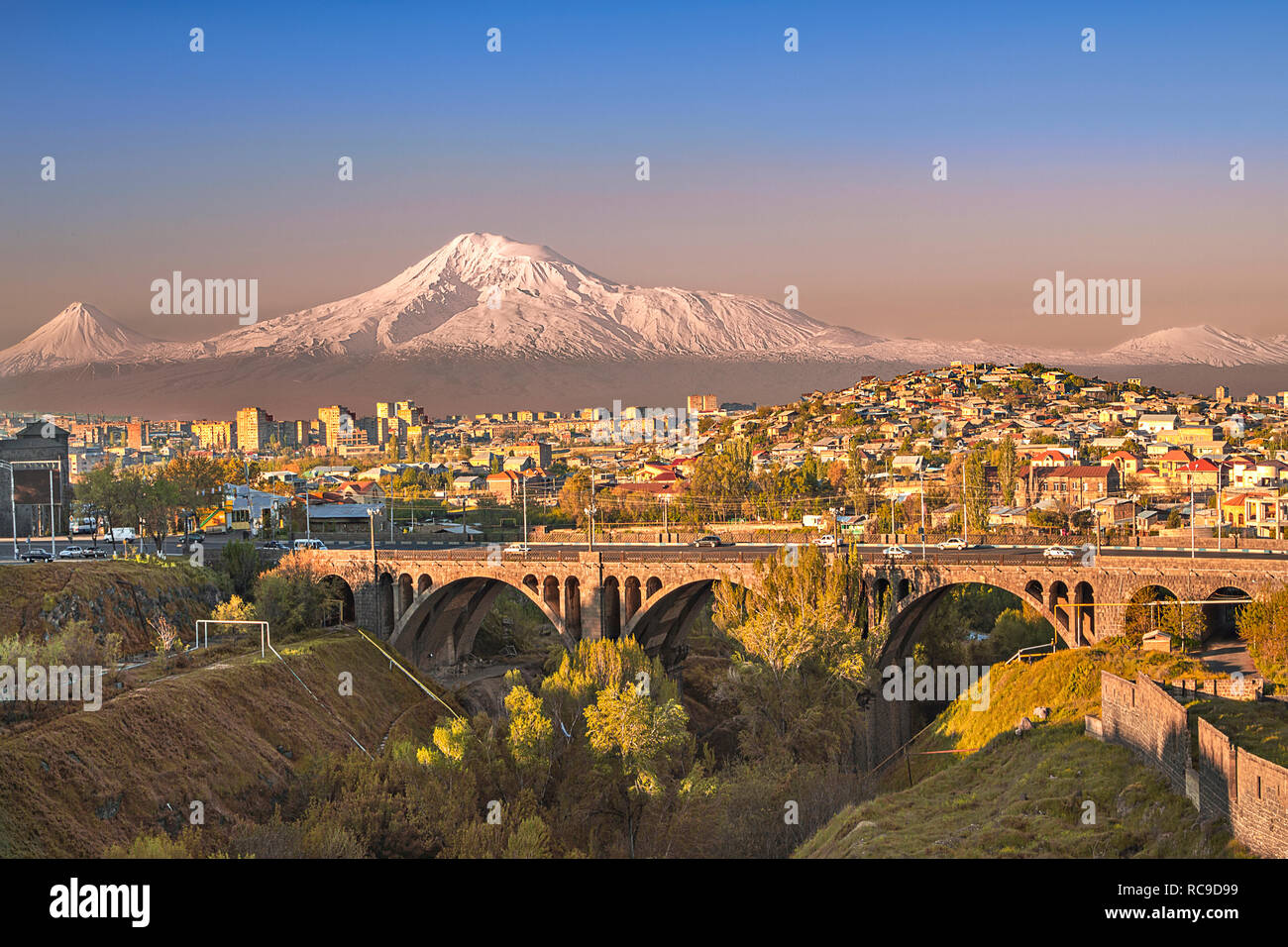 Old arched bridge with the peaks of the Ararat mountain in Yerevan, Armenia. Stock Photo