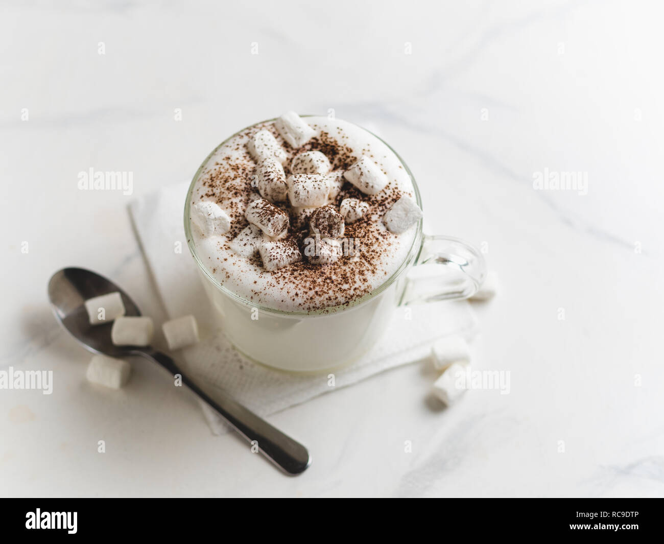 Babyccino whipped milk or cream with cocoa or cinnamon powder and