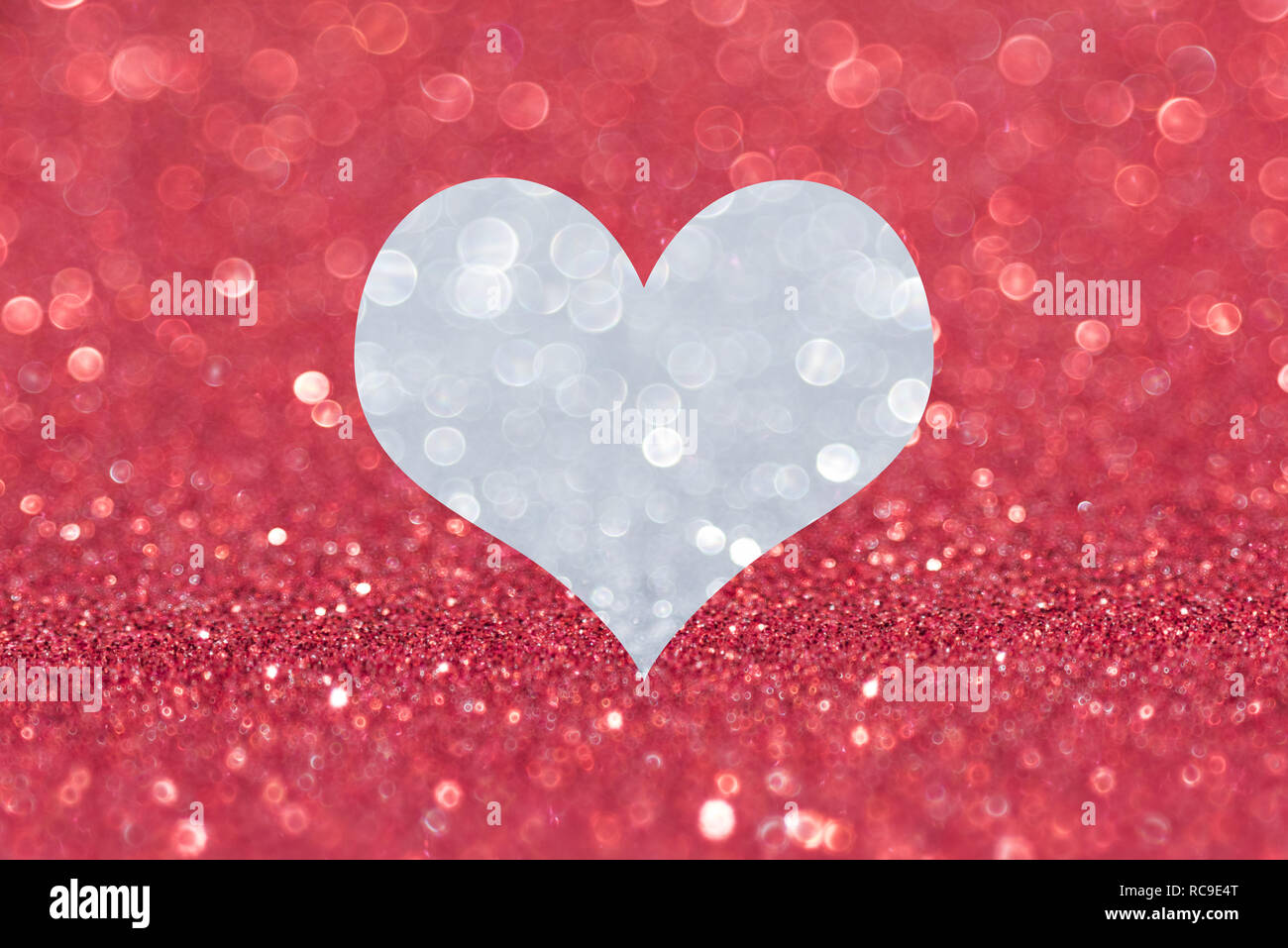 Shiny red background with silver heart Stock Photo - Alamy