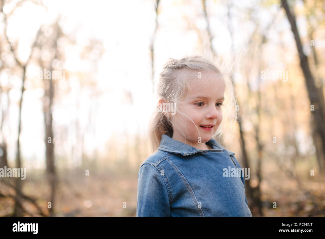 Little girl exploring forest Stock Photo