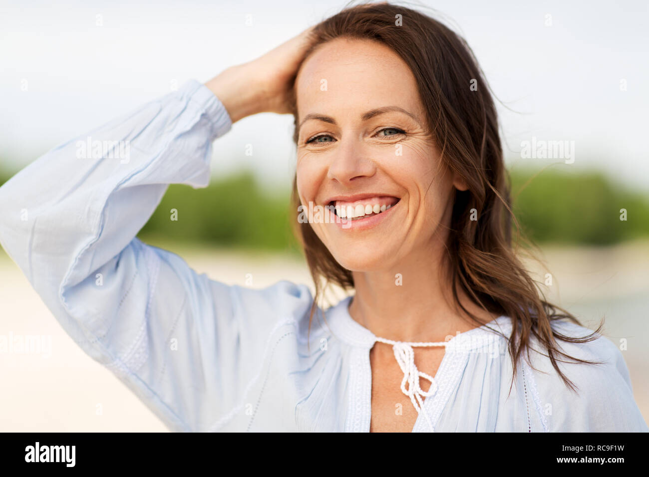 happy smiling woman on summer beach Stock Photo - Alamy